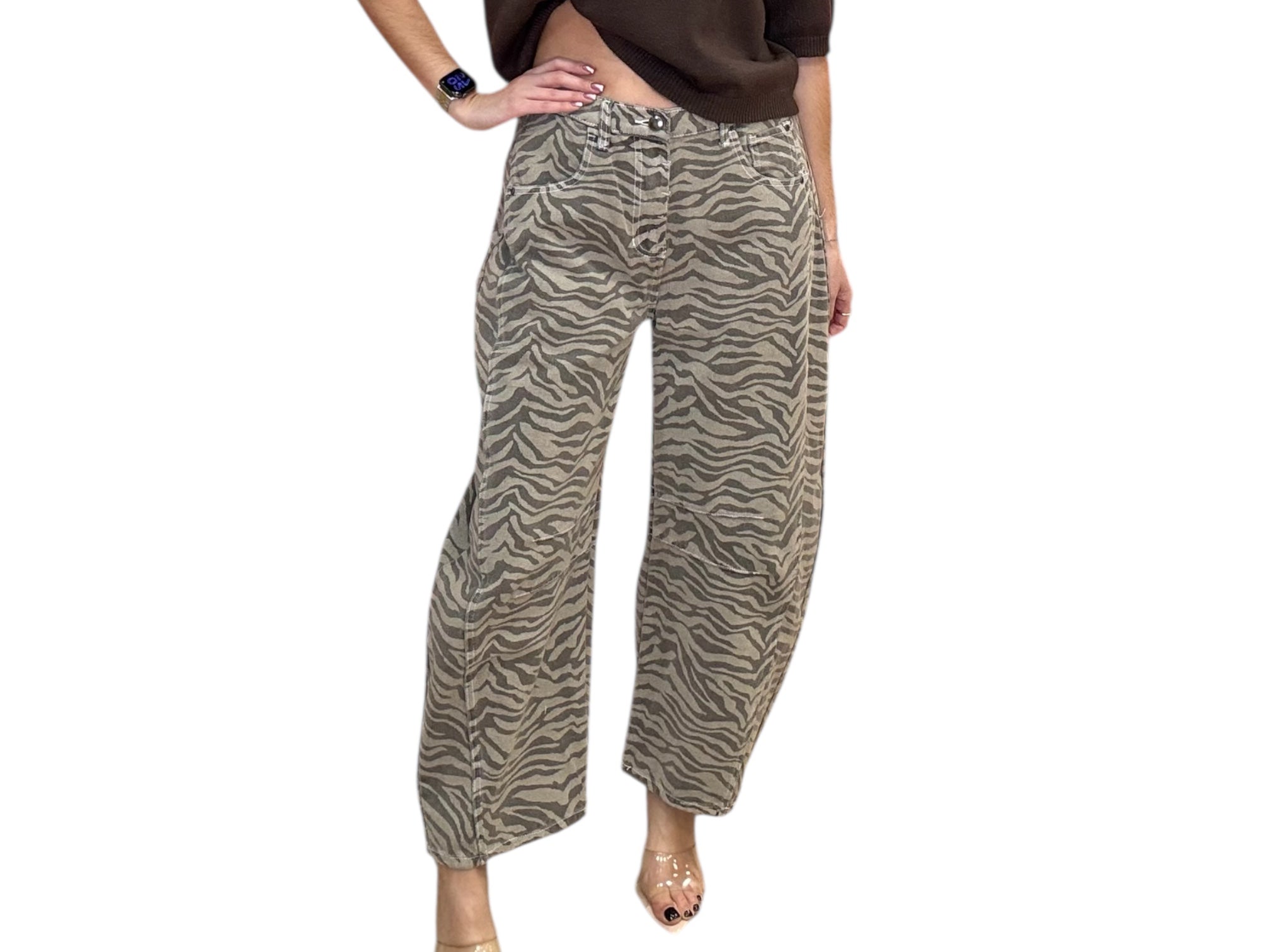 Person wearing zebra print pants on a white background