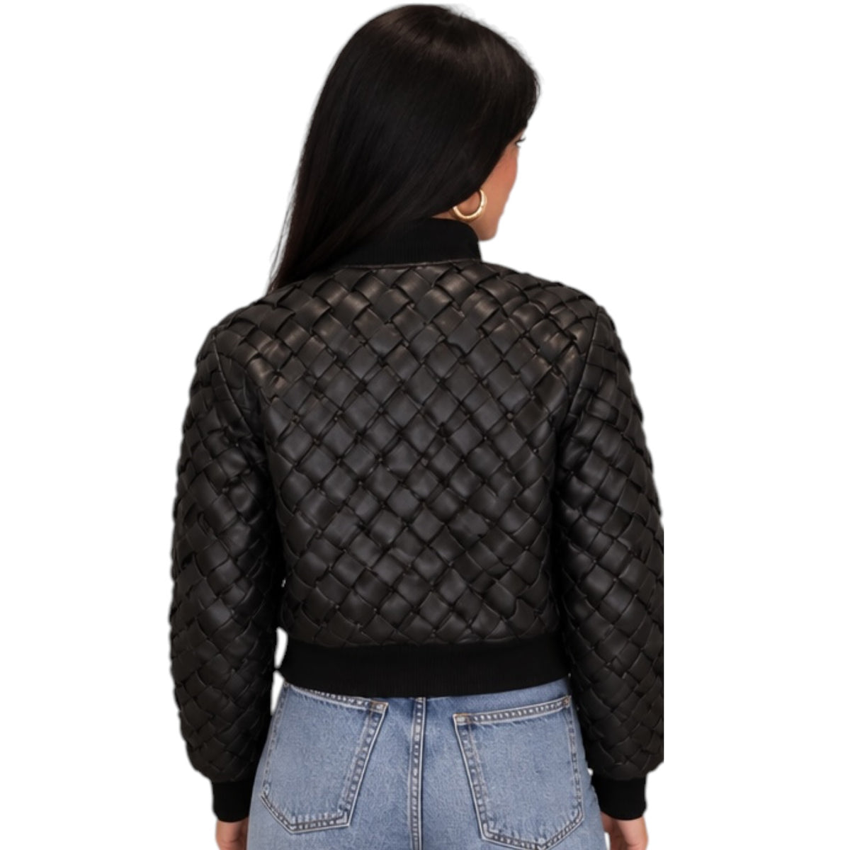 A woman viewed from the back wearing a black quilted bomber jacket with a diamond-stitched pattern, paired with light blue jeans, against a plain white background.