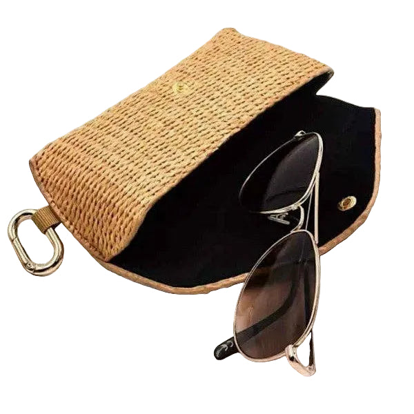 Sunglasses in a woven case on a white background