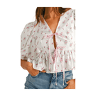 Ditzy Floral Bow Crop Top in pink with puff sleeves and tie front, featuring a peplum style and floral pattern.
