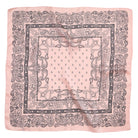 Classic paisley bandana scarf in pink with intricate patterns and a detailed border for versatile styling.