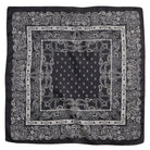 Classic black paisley bandana scarf with intricate white border design, perfect for versatile styling and elegant accessories.