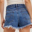 Mid-Rise Distressed Denim Shorts available at Alicia DiMichele Boutique – stylish women’s fashion and accessories.