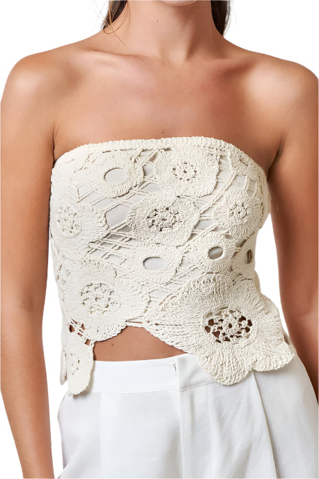 Crochet Flyaway Tube Top featuring intricate crochet detailing and asymmetrical cut, embodying bohemian elegance.