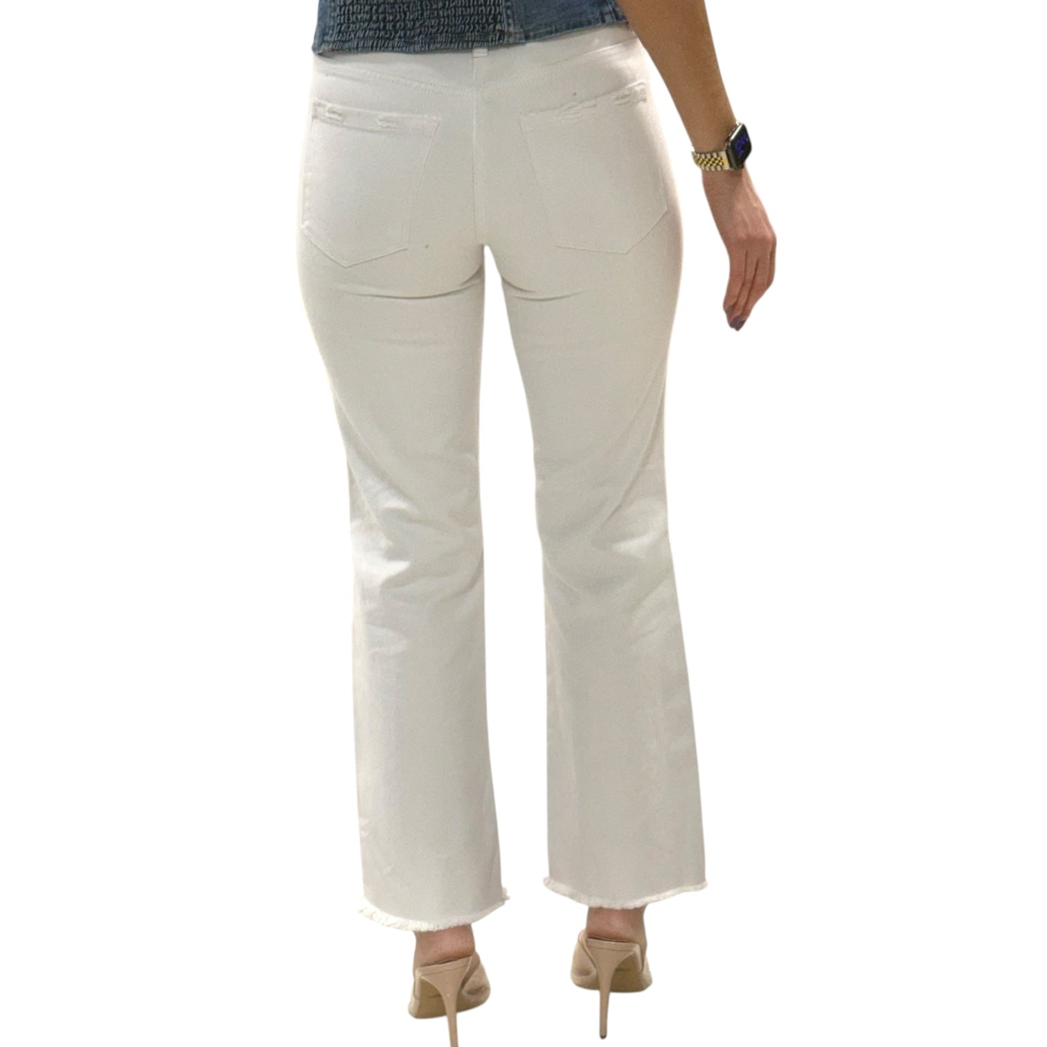 White pants worn by a person on a white background