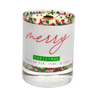 Christmas-themed candle with 'merry Christmas' text and colorful sprinkles on a white background
