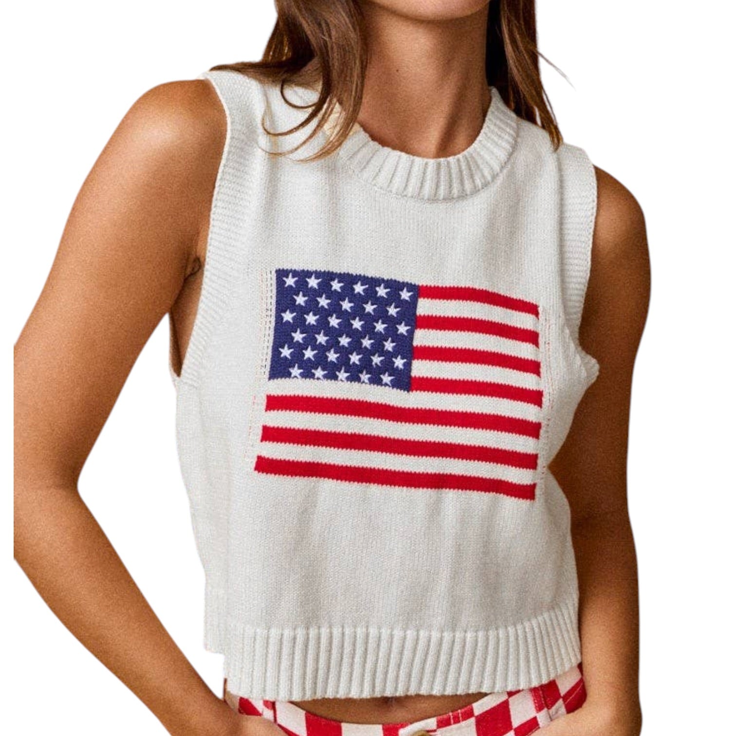 White sleeveless sweater with American flag design worn by a person on a white background