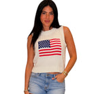 Woman wearing a sleeveless top with an American flag design on a white background
