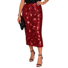 A red sequined midi skirt worn by a model, paired with a black top, black high-heeled sandals, and a black clutch, against a solid white background.