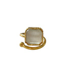 Gold ring with a clear stone on a white background