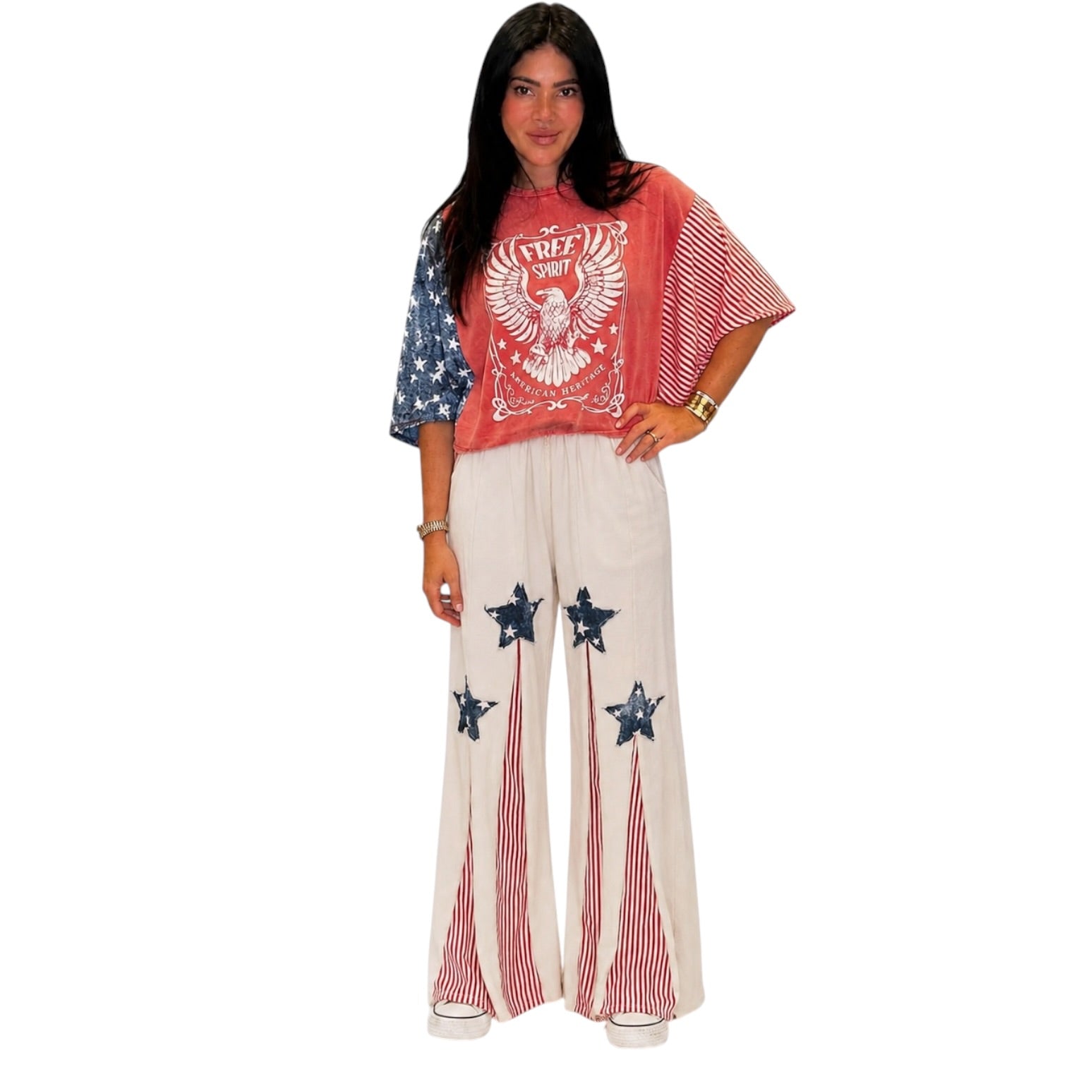 Woman wearing a patriotic outfit with a top and pants on a white background