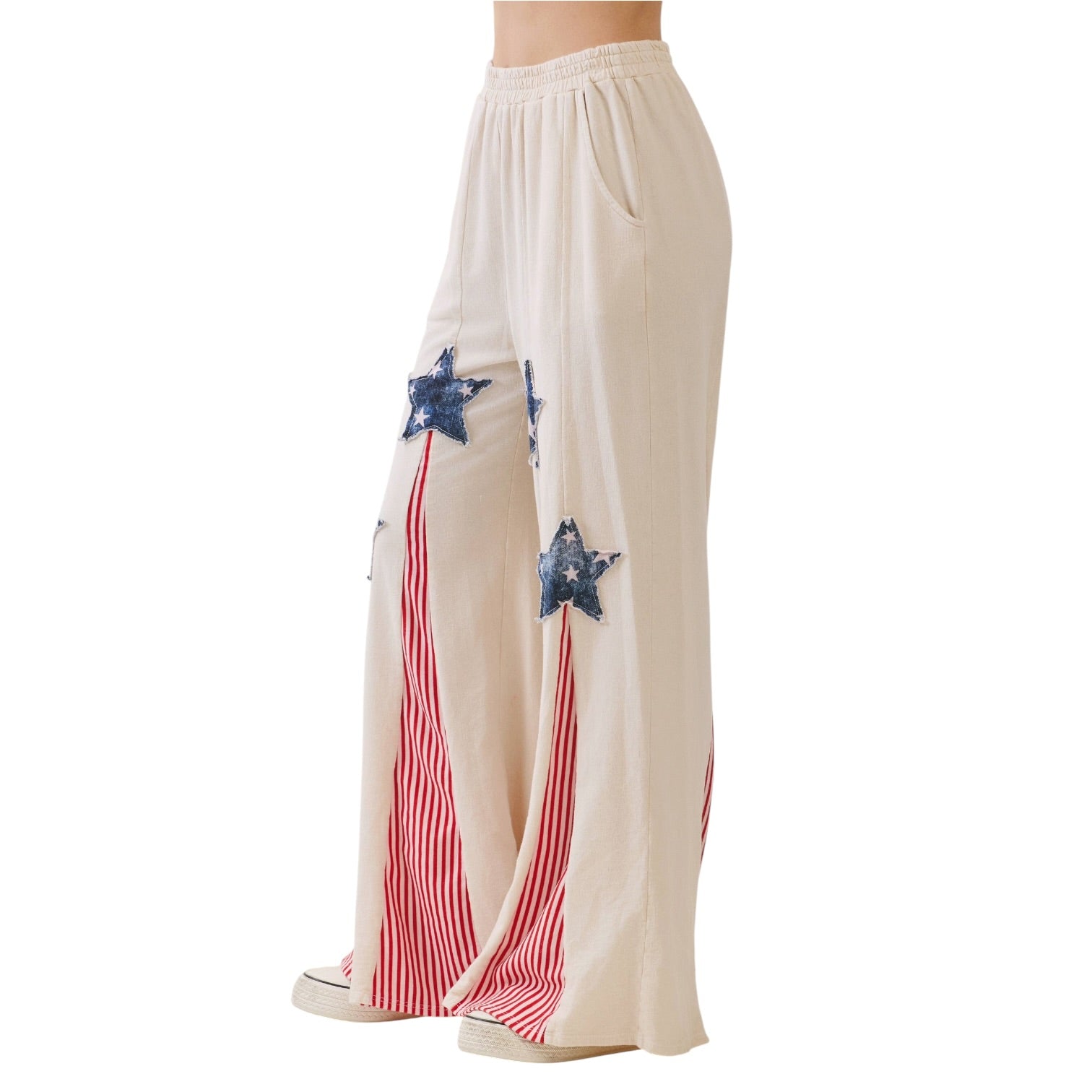 Beige pants with blue star and red stripe design on a white background