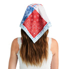 Person wearing a red and white bandana with blue patterns on a white background