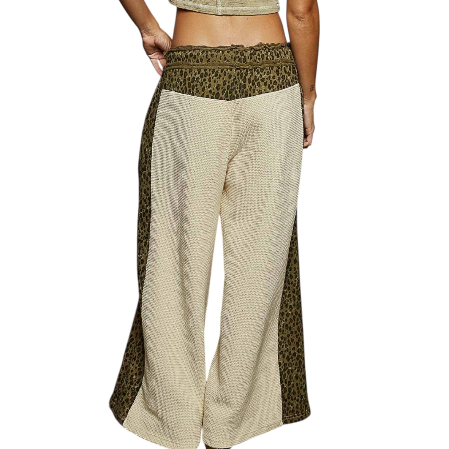 Beige wide-leg pants with leopard print accents on a white background
