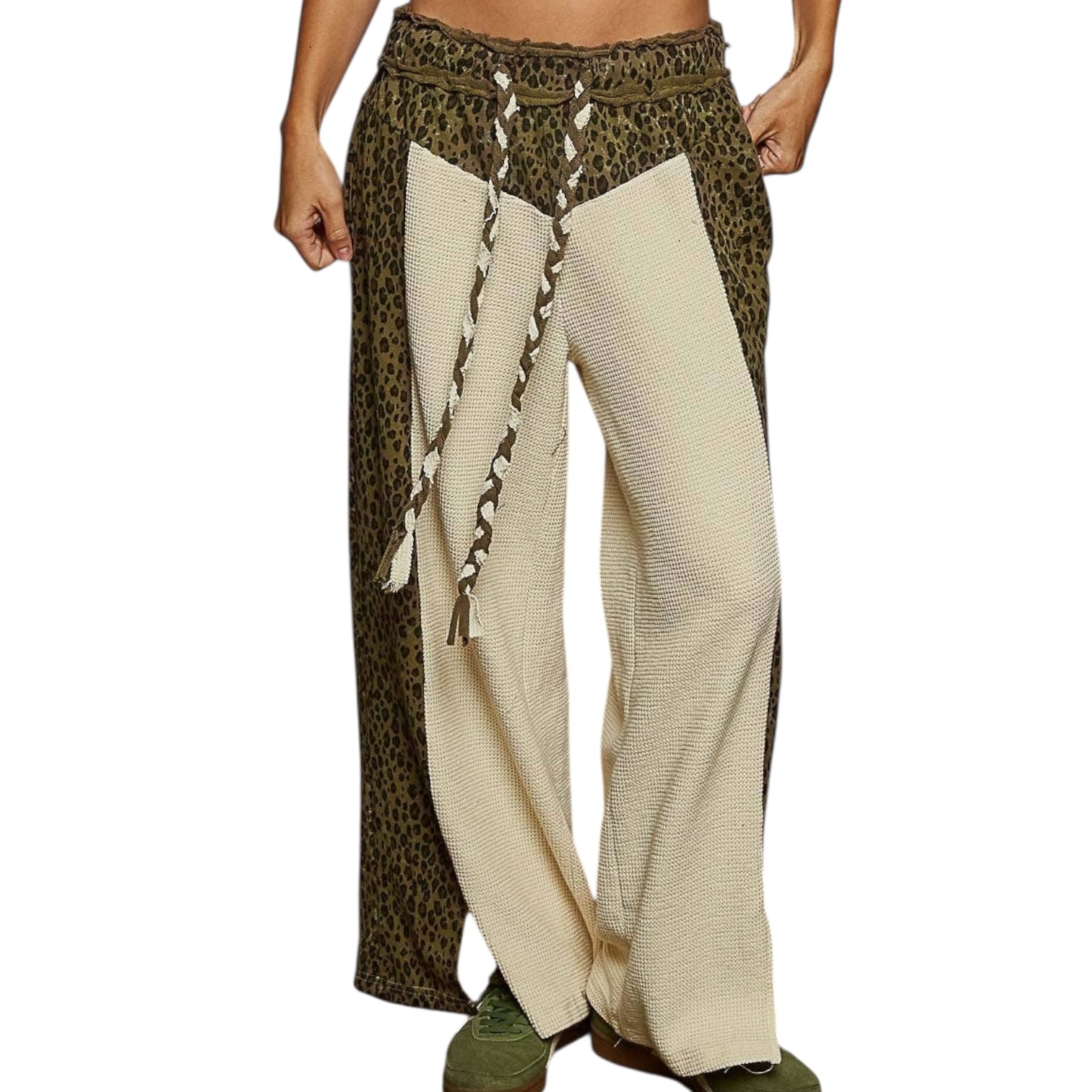 Pants with leopard print and beige pattern on a white background