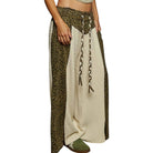 Two-layered skirt with leopard print and beige fabric on a white background