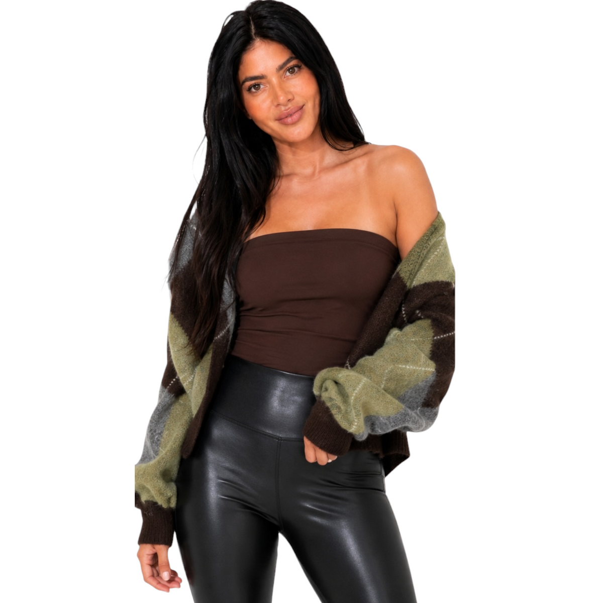 A woman modeling a brown strapless tube top, black faux-leather pants, and a chunky knit cardigan with olive green, brown, and gray color-blocked sleeves, set against a plain white background.