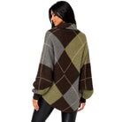 A woman shown from the back wearing a loose, oversized argyle sweater with a high collar. The sweater features a color-blocked pattern of dark brown, olive green, and light gray with thin white grid lines.