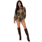 A woman modeling a brown and tan argyle sweater with a matching drawstring tie belt, paired with dark brown knee-high boots, against a solid white background.