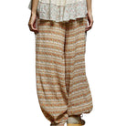 Floral patterned pants on a white background