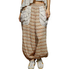 Patterned wide-leg pants worn by a person on a white background