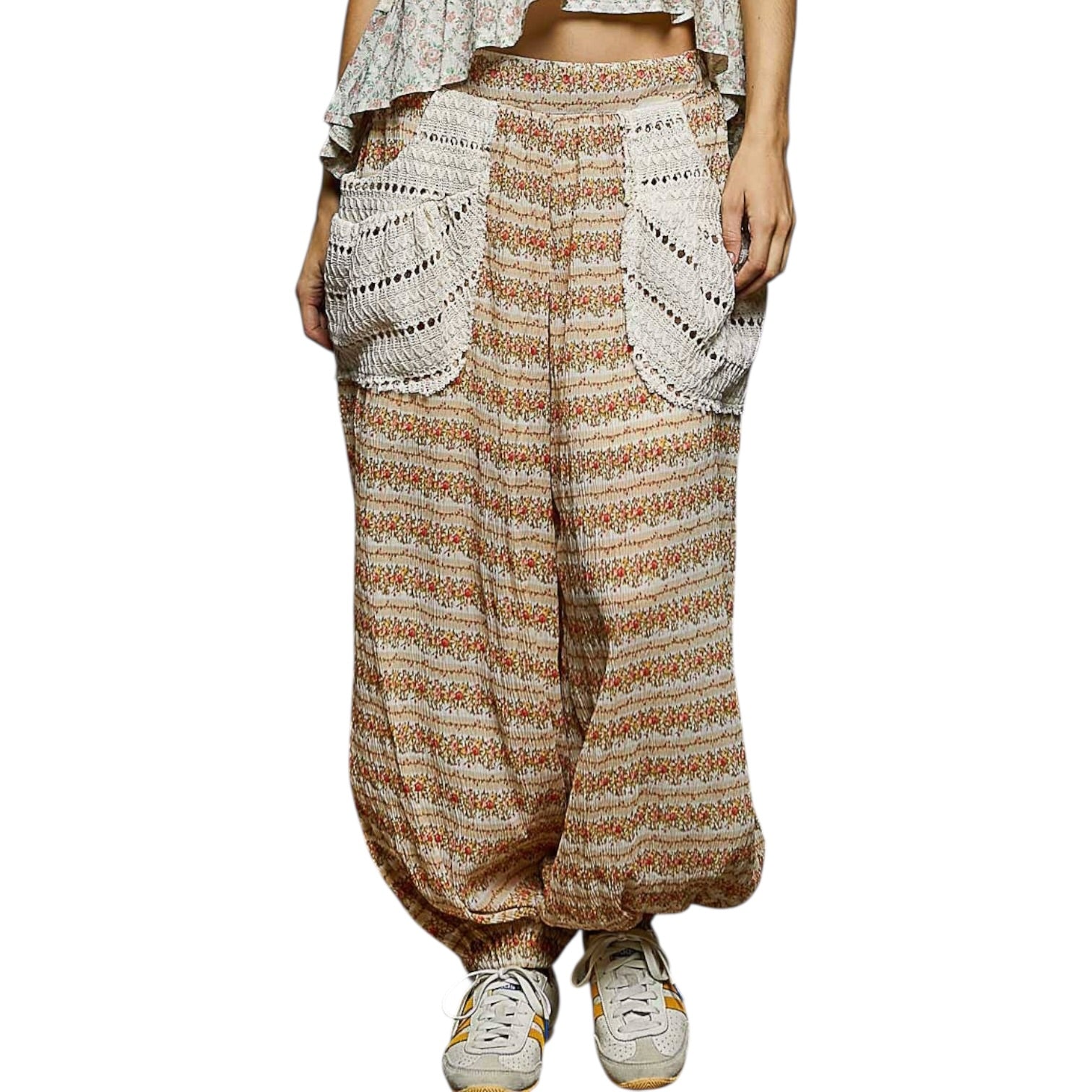 Patterned wide-leg pants worn by a person on a white background