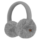 Light gray knit earmuffs with fluffy faux-fur ear cups and a small orange brand tag on the right cup, shown on a plain white background.