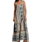 Woman wearing a patterned dress on a white background