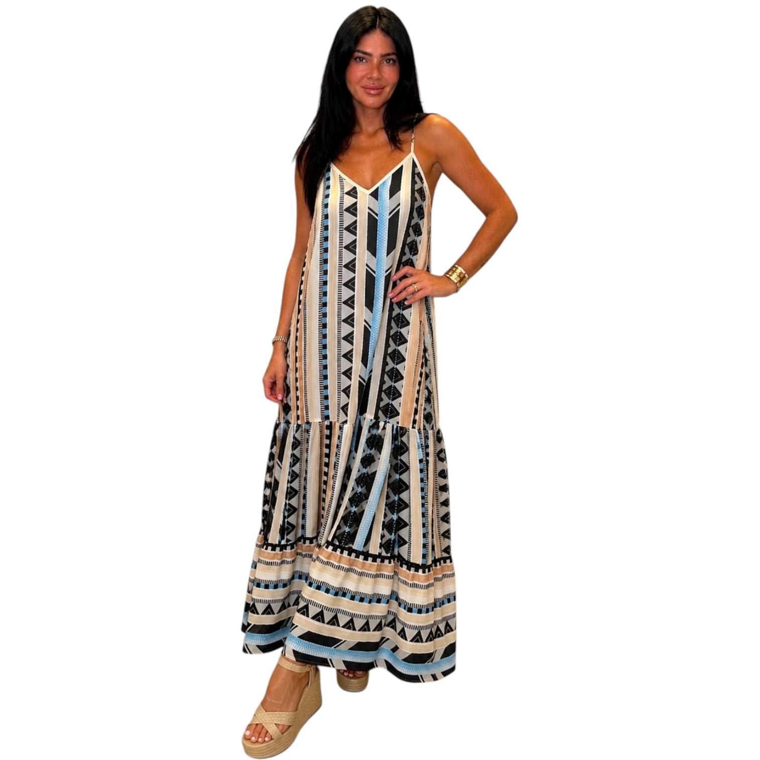 Woman wearing a patterned dress on a white background
