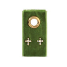 Gold cross earrings on a green velvet card with a gold ring