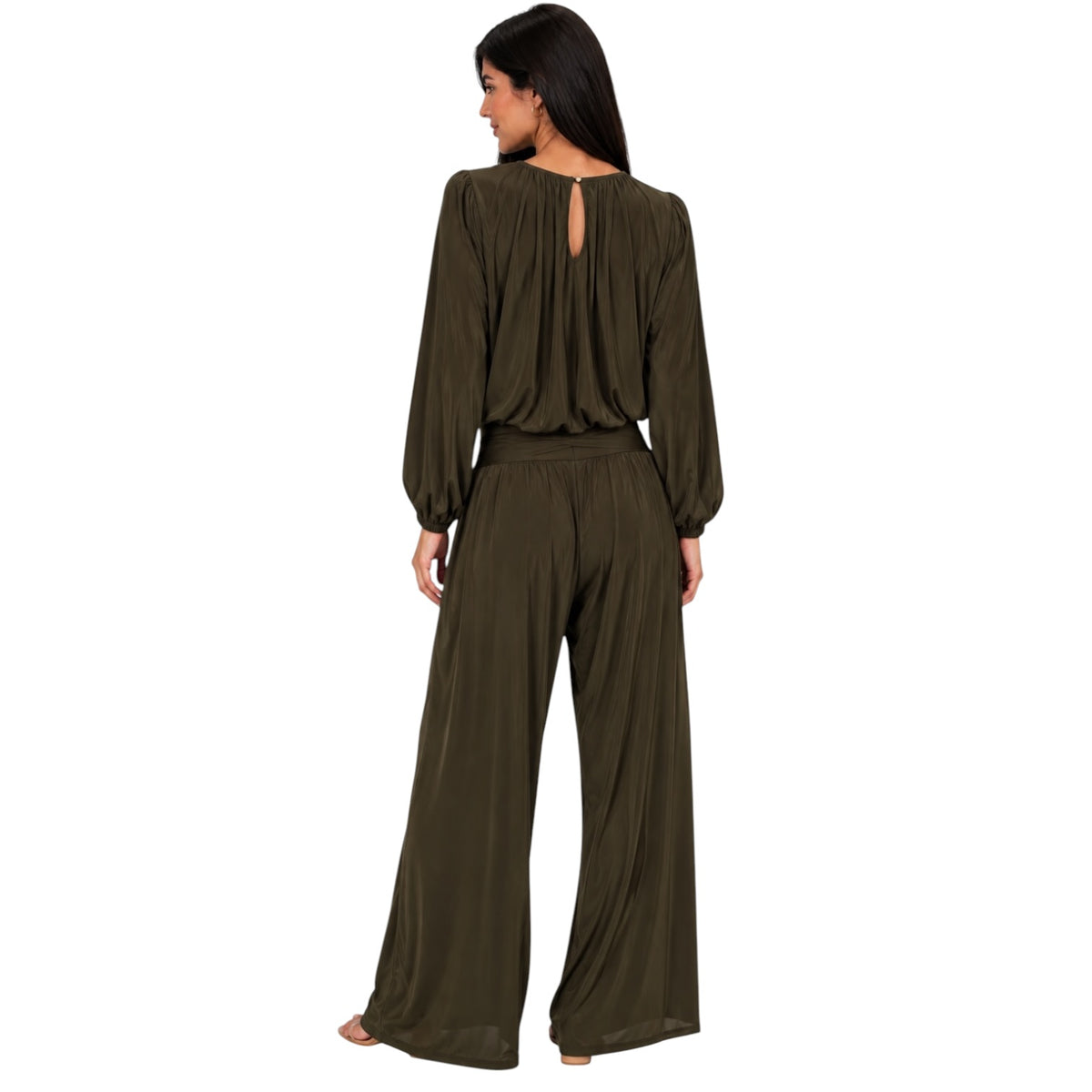 A woman shown from the back wearing an olive green long-sleeve jumpsuit with a keyhole back cutout, on a plain white background.