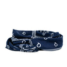 Navy blue bandana with white patterns on a light gray background
