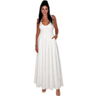 Woman wearing a white sleeveless dress on a white background