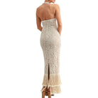 Beige lace dress with fringe hem on a white background