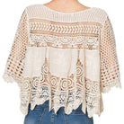 woman wearing crochet top on white background