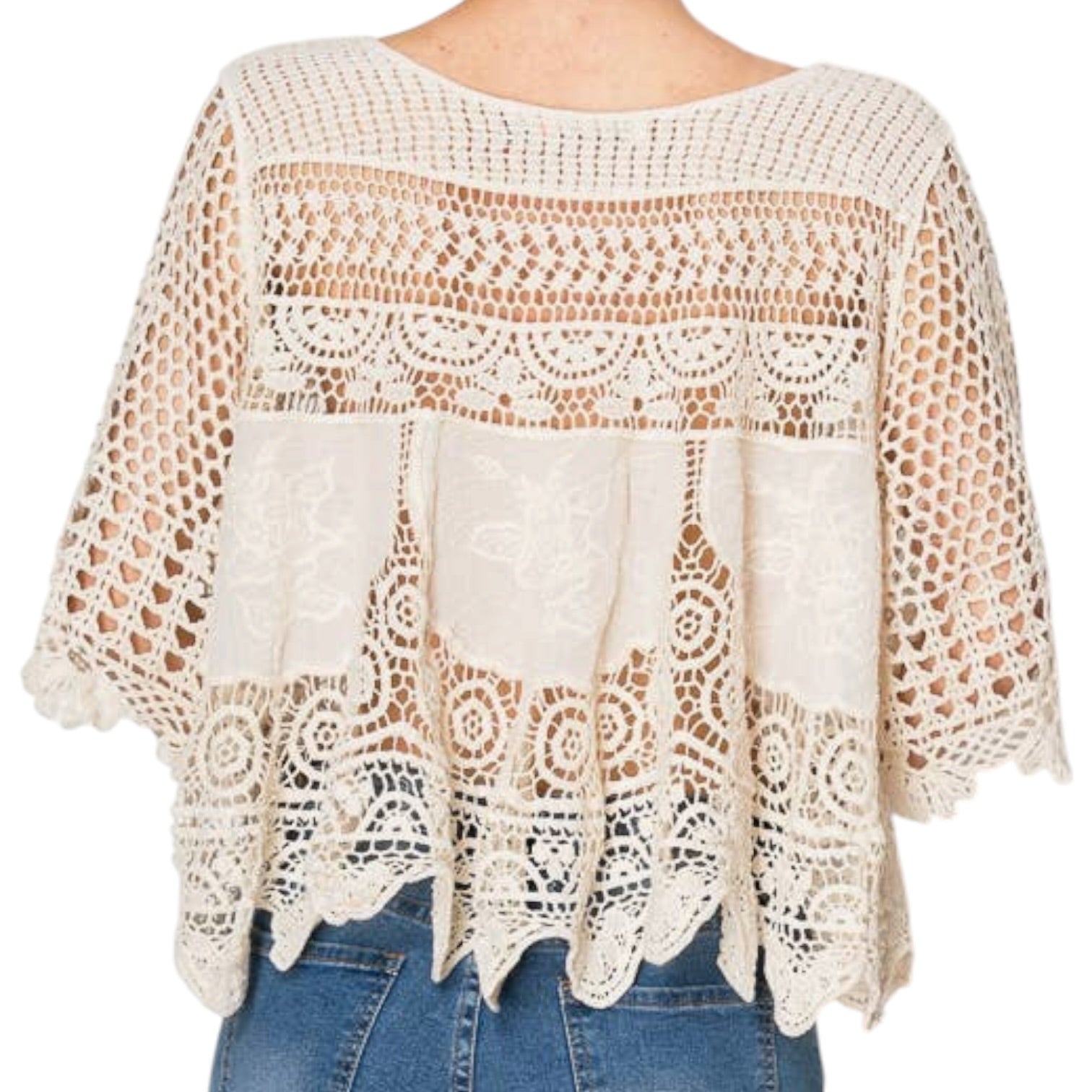 woman wearing crochet top on white background