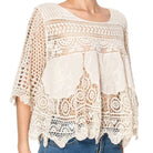 woman wearing crochet top on white background