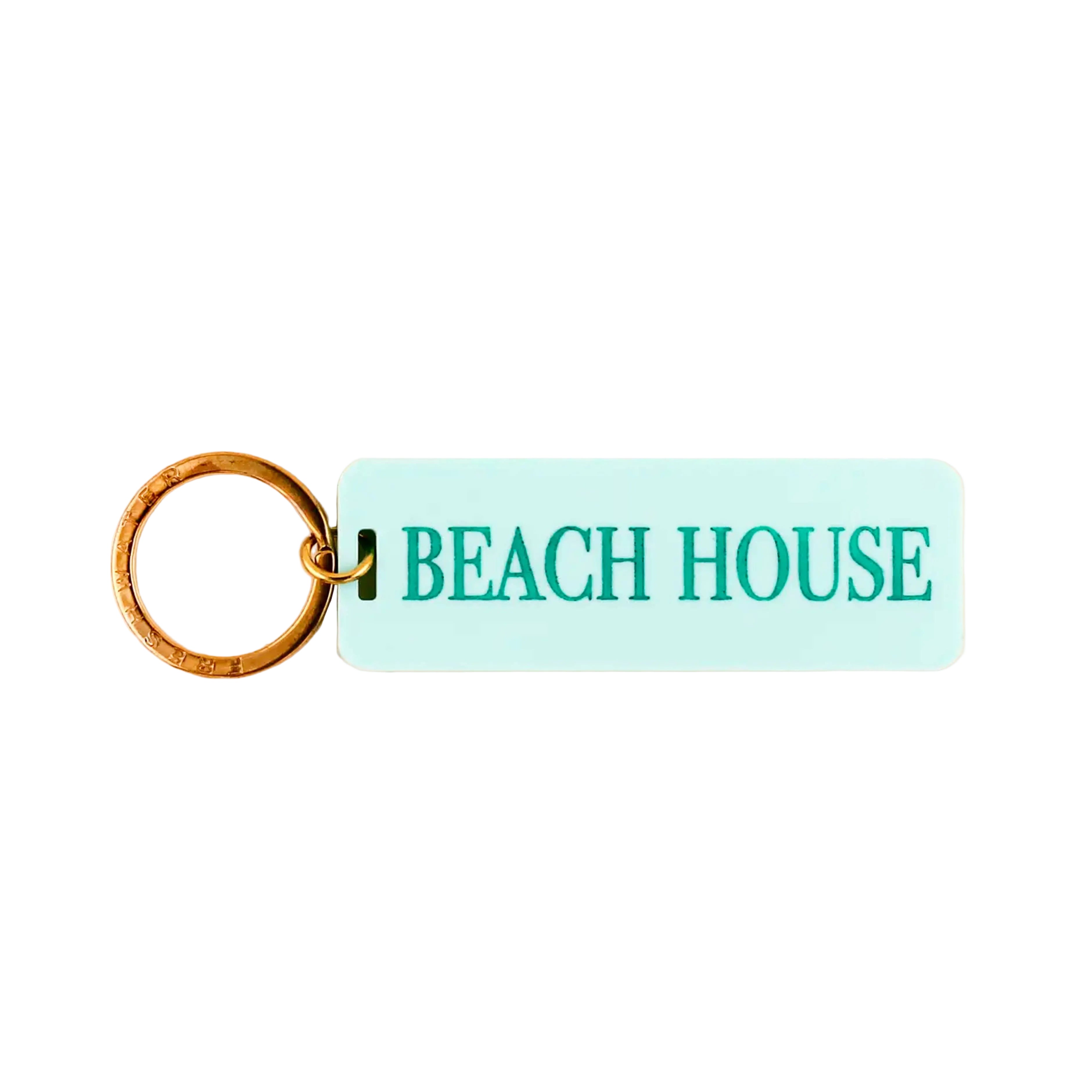 Keychain with 'BEACH HOUSE' text on a light blue rectangular tag against a white background