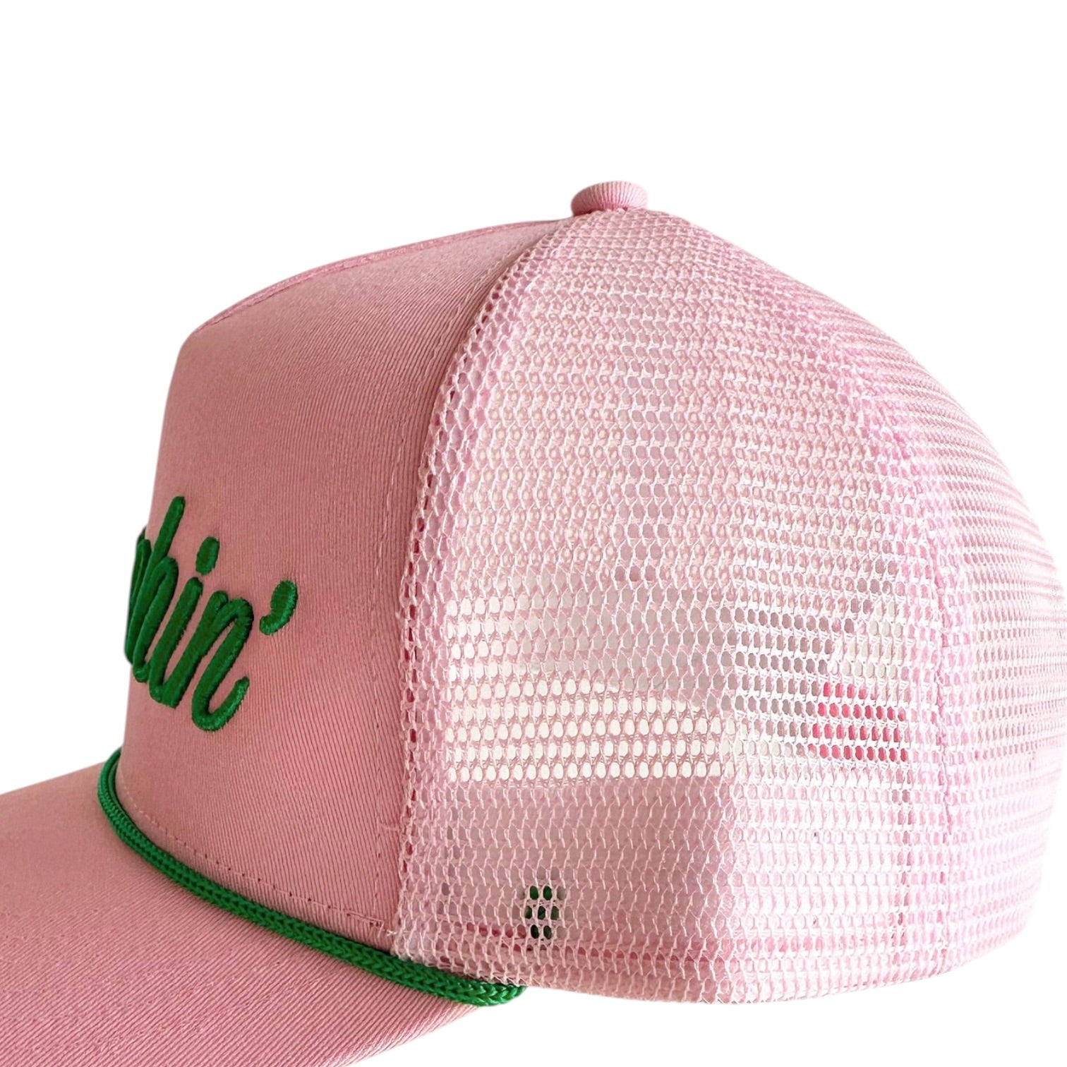 Pink mesh cap with green logo on a white background