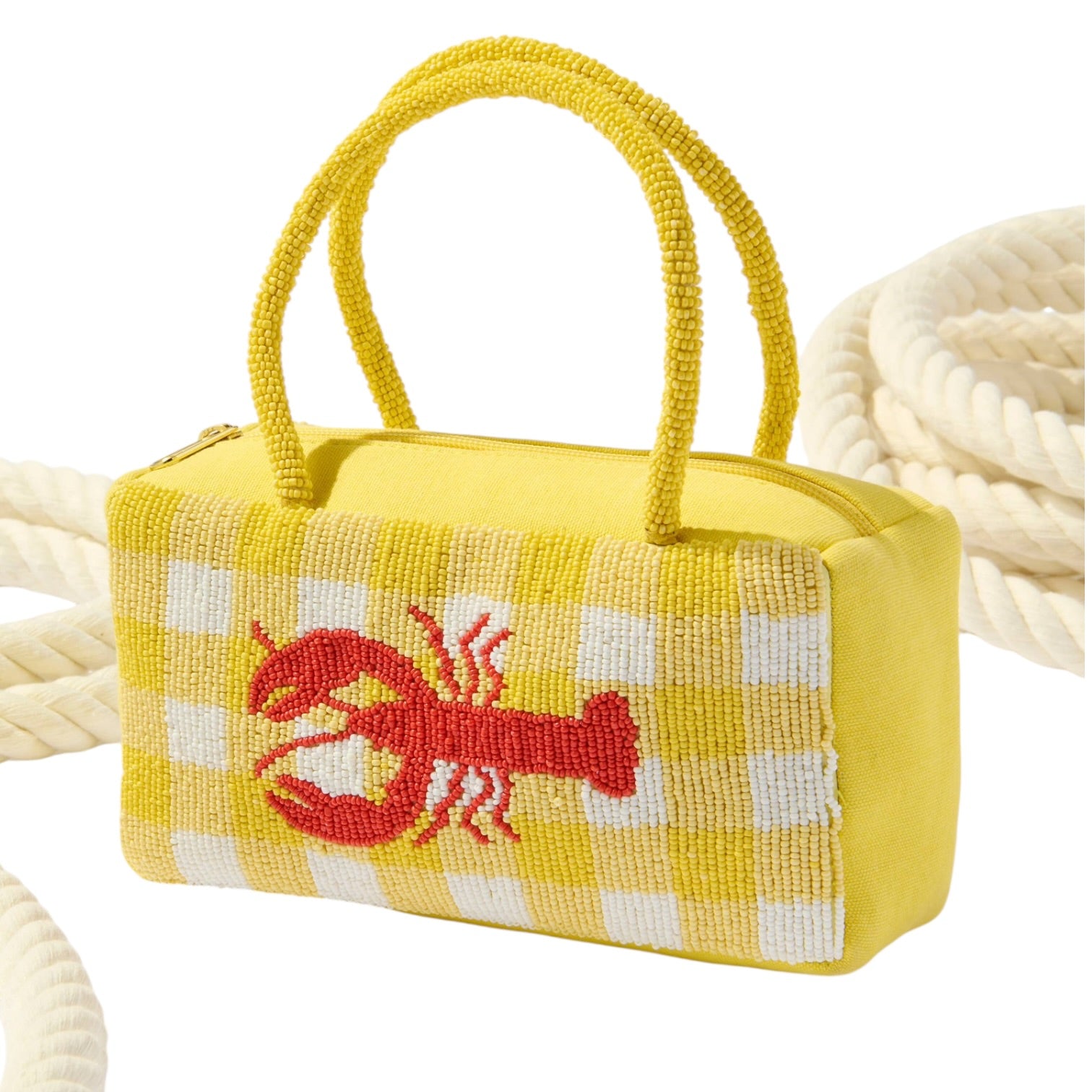 Yellow handbag with a red lobster design on a white background