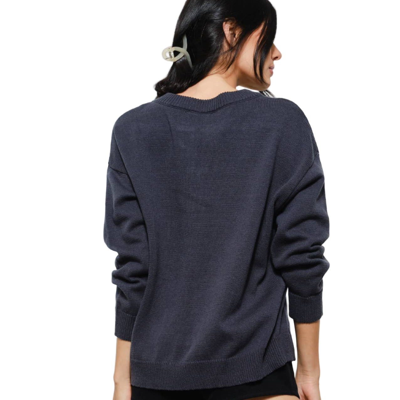 Person wearing a dark blue sweater on a white background