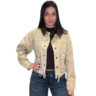 Woman wearing a beige jacket and blue jeans on a white background