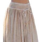Beige lace skirt with a drawstring waist on a white background