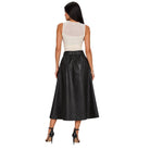A woman shown from the back wearing a sleeveless white top with a sheer back panel and a high-waisted black faux-leather midi skirt, paired with black high-heeled sandals, against a plain white background.