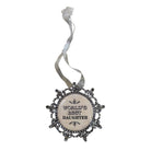 A decorative hanging ornament with a round cream center and ornate silver filigree border, printed with the phrase 'WORLD'S BEST DAUGHTER' in black lettering, suspended from a sheer silver ribbon on a white background.