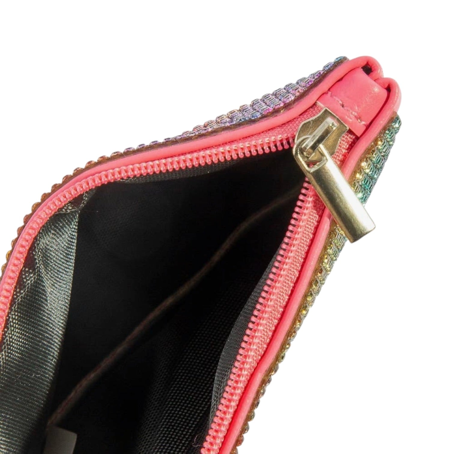 Close-up of a pink zippered pouch with decorative trim on a white background