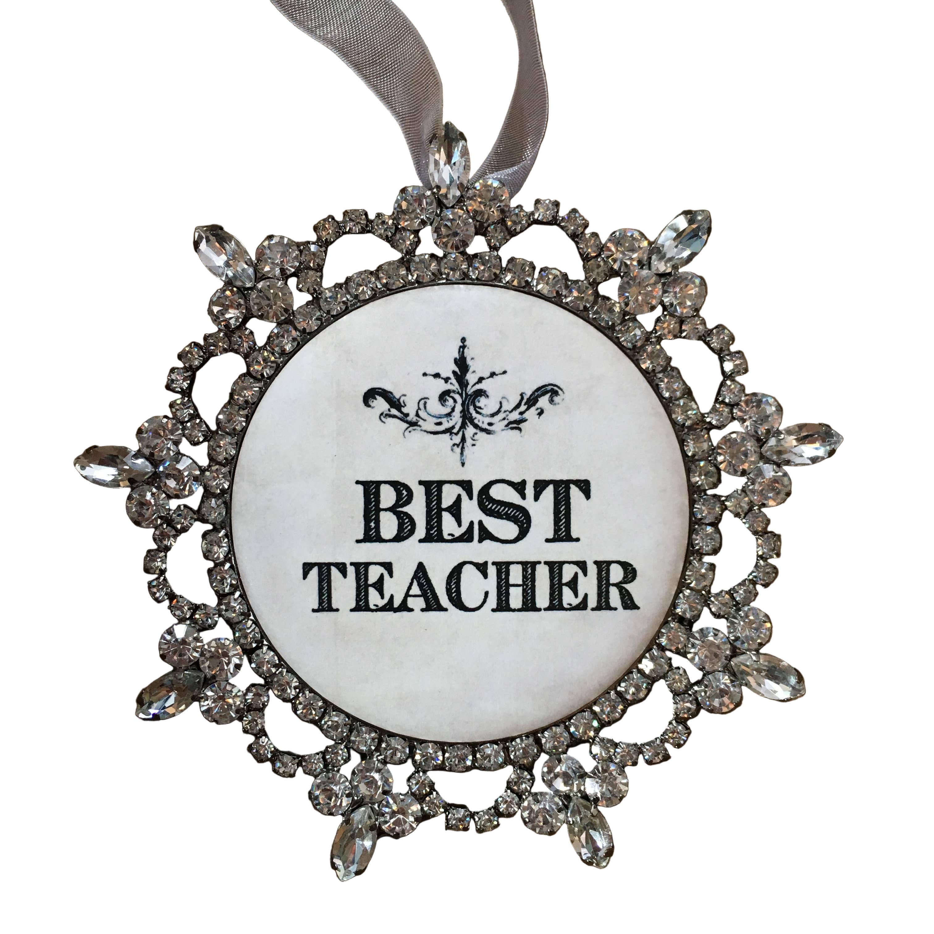 Decorative ornament with 'BEST TEACHER' text on a white background
