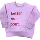 Pink sweatshirt with red text 'better not pout' on a white background
