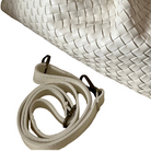 White woven bag with matching strap on a white background