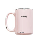 Pink mug with the word 'bitchy' printed on it against a white background